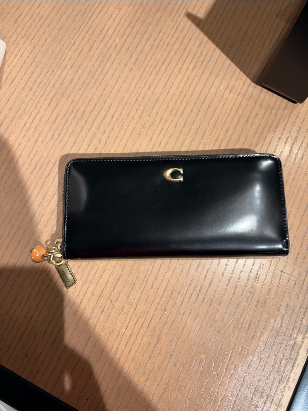 Coach Black Patent Zip Phone Case with Gold Hardware retail boutique store new